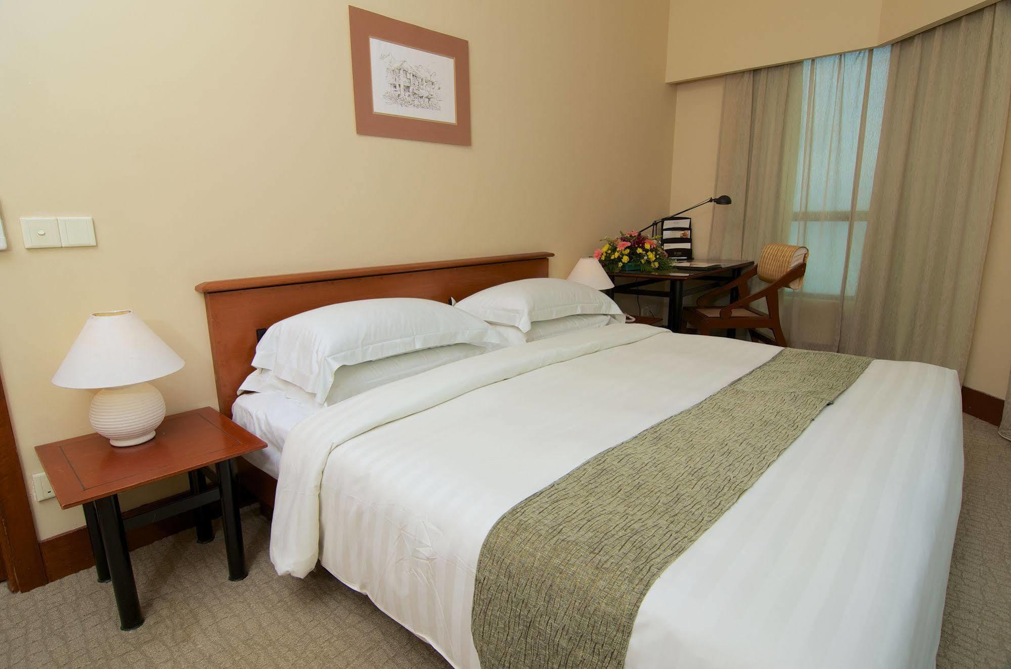 ذا جورني ريزورت هوتيل آند ريزيدنسز جورج تاون المظهر الخارجي الصورة A bedroom at the hotel